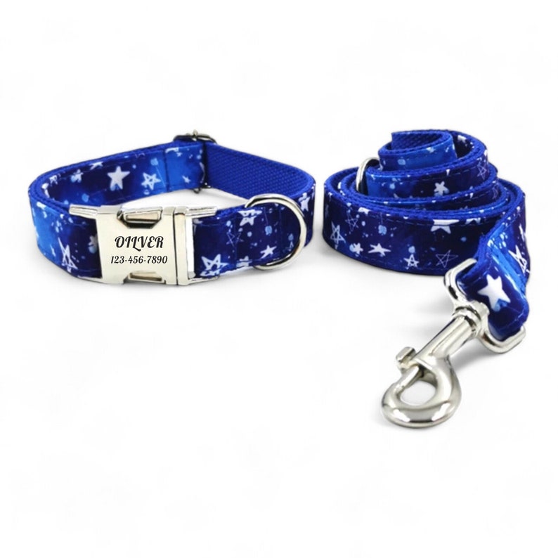 May include: Blue dog collar and leash set with a white star pattern. The collar has a silver buckle with the name "Oliver" and phone number "123-456-7890" engraved on it.