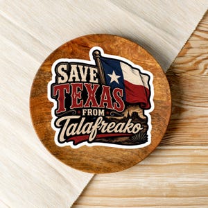 May include: A circular sticker featuring the text SAVE TEXAS FROM TALAFREAKO in bold red and cream lettering. The design includes a waving Texas flag with a single white star on a blue field, red and white stripes, and a desert landscape silhouette.