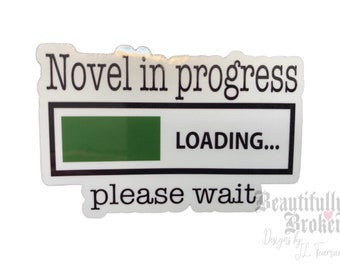 May include: A white sticker with black text that reads "Novel in progress" with a green progress bar that says "LOADING..." and "please wait" below the bar.