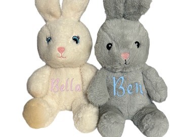 May include: Two plush bunny toys, one white with pink embroidery that says "Bella" and one gray with blue embroidery that says "Ben".