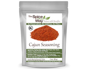 May include: A silver resealable pouch of Cajun seasoning with the brand name "The Spice Way" and the text "Nature with Benefits. No Preservatives, No Additives, No Fillers". The pouch contains a red and brown spice blend. The pouch is labeled with the ingredients and nutrition facts. The pouch is 2 ounces (56 grams).