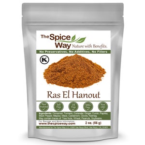 May include: A resealable pouch of Ras El Hanout spice blend, a blend of cinnamon, turmeric, coriander, ginger, cumin, paprika, black pepper, allspice, mace, cardamom, cloves, and nutmeg. The pouch is labeled "The Spice Way" and features a green leaf logo. The pouch is 2 ounces (56 grams).