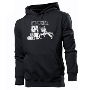 May include: Black hooded sweatshirt with a white graphic print of a bird's talon and the text "Falconry. I play with sharp objects."
