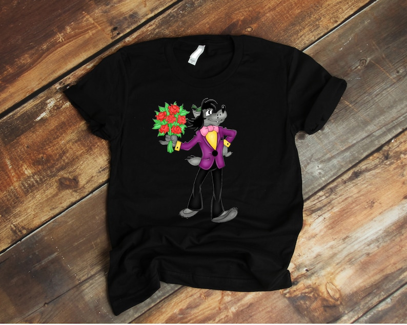 May include: Black t-shirt with a cartoon wolf wearing a purple suit and holding a bouquet of red roses.