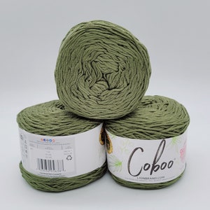 May include: Three skeins of green Coboo yarn, a cotton blend yarn, with the brand name and website printed on the label.