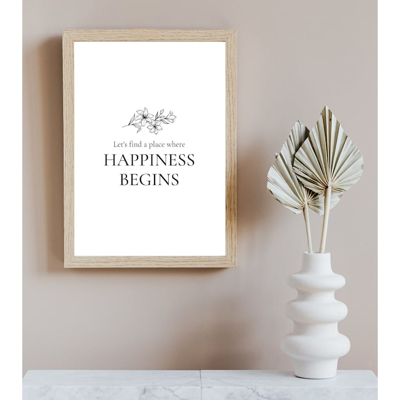 Puede incluir: Una impresi&oacute;n enmarcada con una ilustraci&oacute;n floral en blanco y negro y el texto "Let's find a place where HAPPINESS BEGINS".