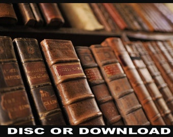 May include: A close-up of a bookshelf filled with antique leather-bound books. The books are arranged in rows and have a worn, aged appearance. The spines of the books are visible, and some of them have gold lettering.