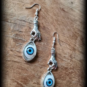 Unique half-long earrings with hands holding a blue/green/brown eye of your choice on request