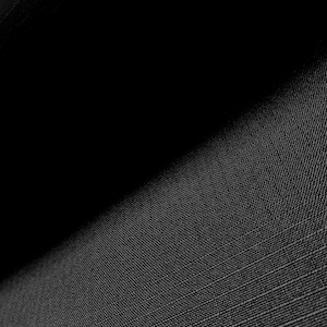 May include: Close-up of a black fabric with a textured woven pattern.