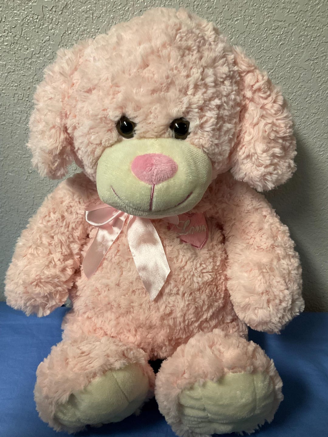 犬の赤ちゃんぬいぐるみピンクりぼん インターアメリカンプロダクツ 復元済み ピンクのリボン付きぬいぐるみ