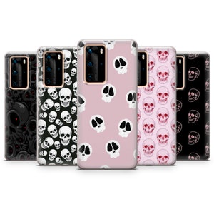 May include: Set of six phone cases with different skull designs. The cases are clear and show a pink, black, and white skull pattern.