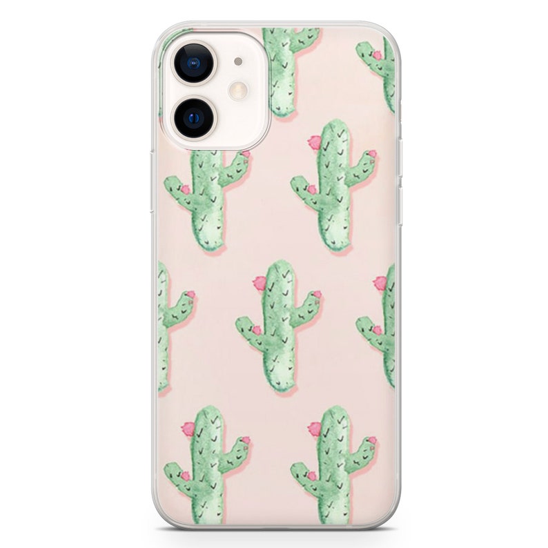 May include: A clear phone case featuring a repeating pattern of green watercolor cacti with pink flowers on a light pink background. The phone case is designed for an iPhone.