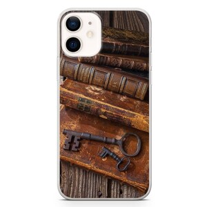 May include: A stack of old, leather-bound books with a rusty key on top. The books are on a wooden surface.