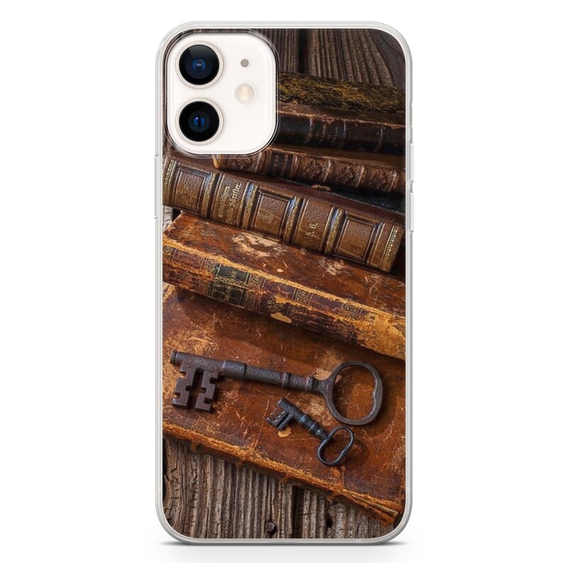 May include: A stack of old, leather-bound books with a rusty key on top. The books are on a wooden surface.