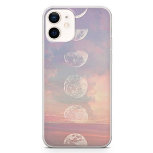 May include: A clear phone case with a design of a pink and orange sunset with white moons in different phases.