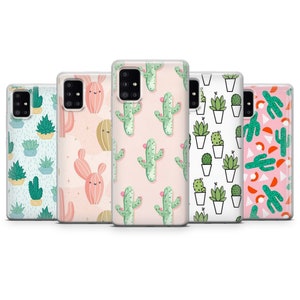 May include: A collection of five phone cases with various cactus and succulent designs. The cases feature patterns of green cacti with pink flowers, potted succulents, and other desert plant illustrations on a white or pastel background.