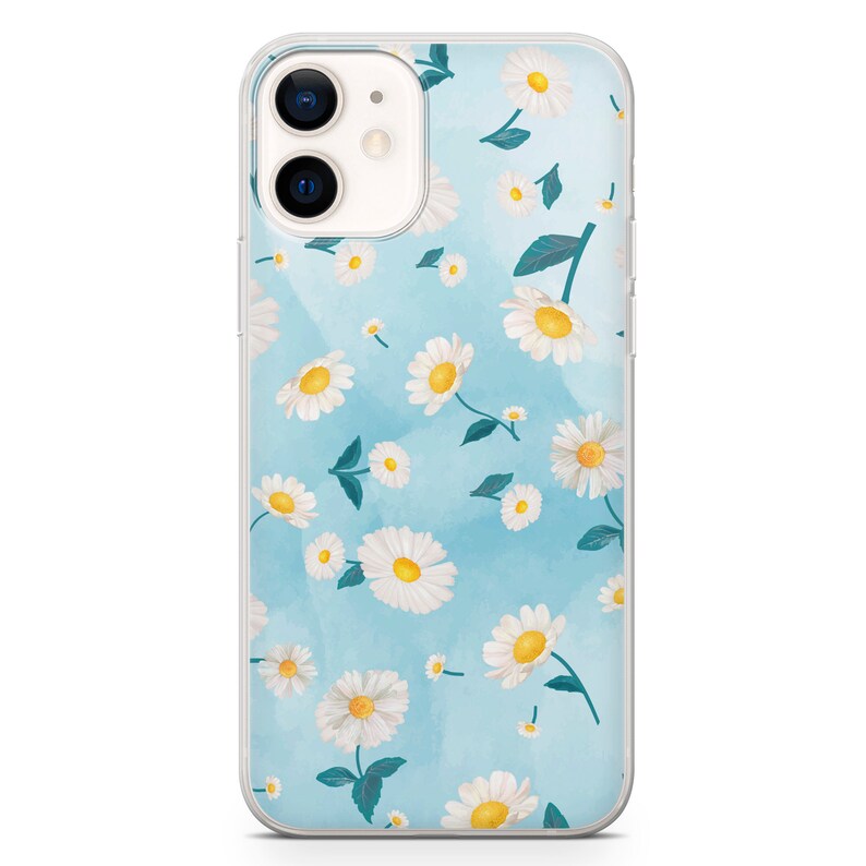May include: Clear phone case featuring a floral design of white daisies with yellow centers and green leaves scattered on a light blue watercolor background. The case is designed for an iPhone 11.