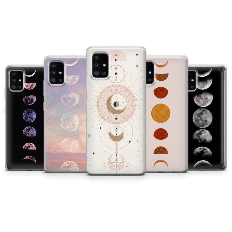 May include: Five different phone cases with moon phases designs. The cases are clear and show the phone's color through the case. The designs include a crescent moon, a full moon, and a half moon.