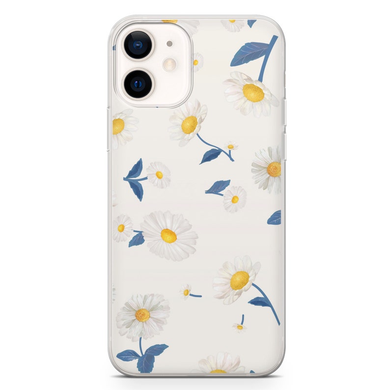 May include: Clear phone case with a daisy floral pattern. The case features white daisies with yellow centers and blue leaves scattered across the surface. The case is designed to fit a smartphone.