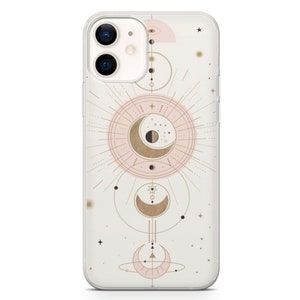 May include: A clear phone case with a pink and gold design featuring a crescent moon, stars, and geometric shapes.