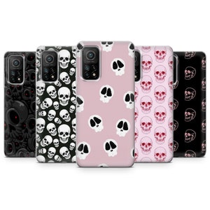 May include: Set of five phone cases with different skull designs. The cases are clear and show a pink, black, and white skull pattern.