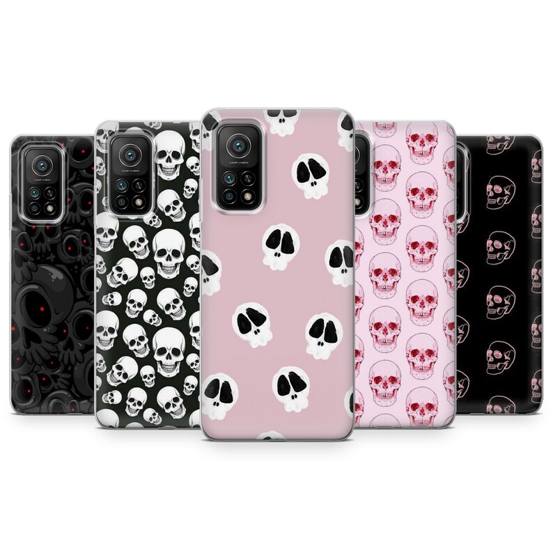 May include: Set of five phone cases with different skull designs. The cases are clear and show a pink, black, and white skull pattern.