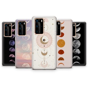 May include: Five different phone cases with moon phases designs. The cases are clear and show the phone's camera lens. The designs include a crescent moon, a full moon, and a moon with stars. The cases are all in a row on a white background.