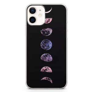 May include: A clear phone case with a black background and a design of the moon in different phases. The moon phases are in shades of pink and purple.