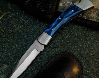 Navaja plegable de acero D2 con mango de resina y funda de cuero