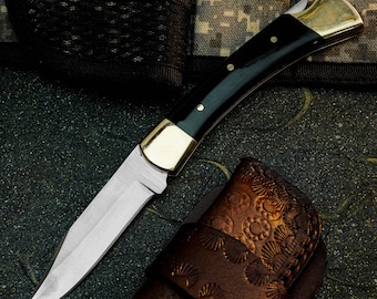 Navaja plegable de acero D2 con mango de resina y funda de cuero