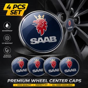 May include: Set of four Saab wheel center caps. Each cap features a dark blue background with the Saab logo, a red griffin with a gold crown, and the brand name in silver. The caps are waterproof, UV resistant, and scratch resistant.