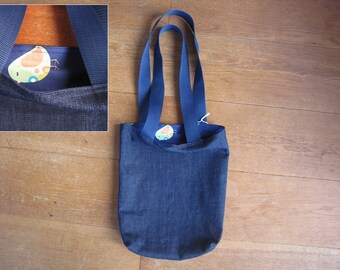 Dark blue denim tote bag with birds lining