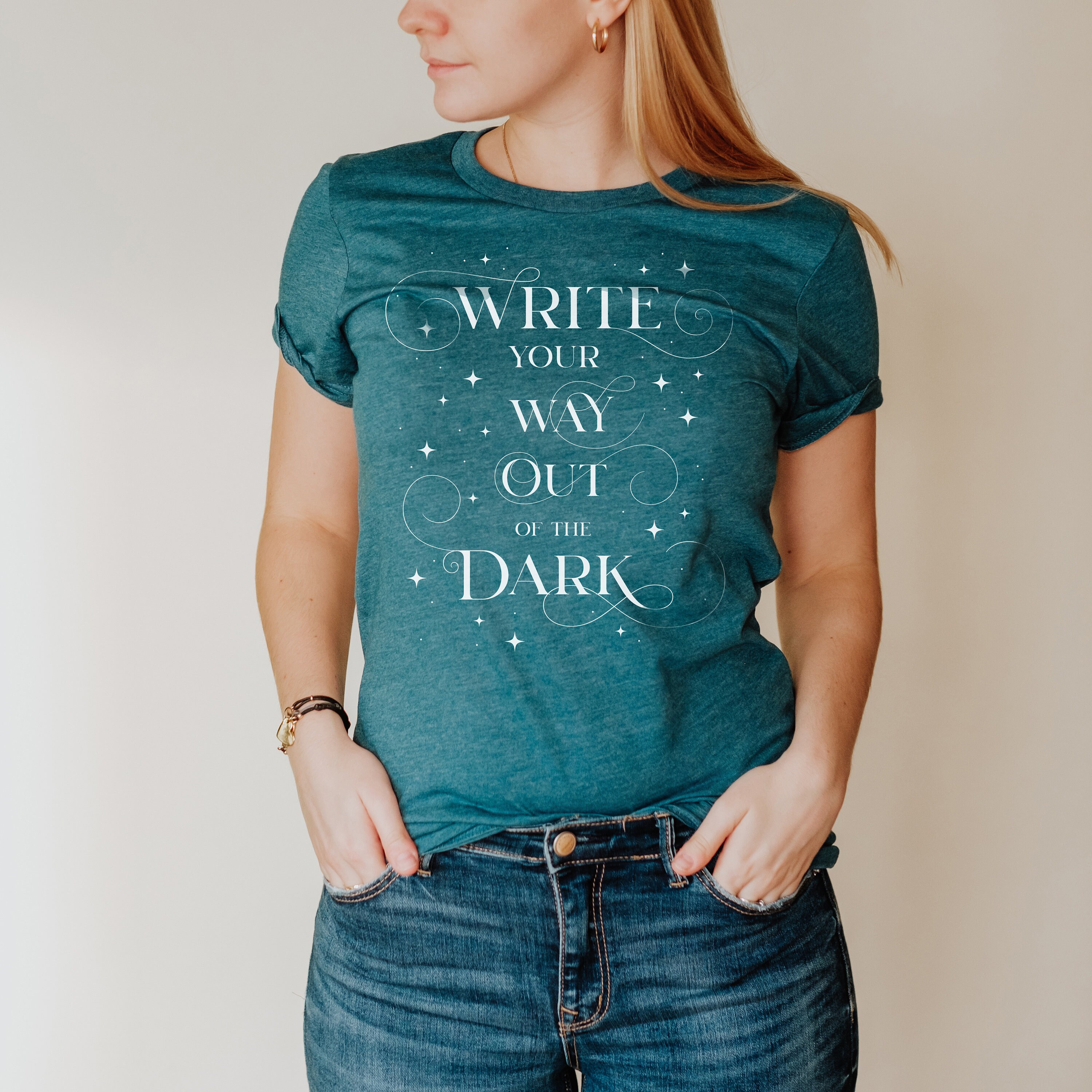 Teal shirts top with writing