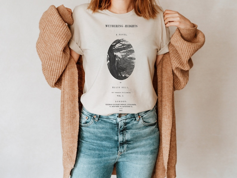 May include: A white t-shirt with a black and white illustration of a tree and the text "Wuthering Heights, A Novel, by Ellis Bell, in Three Volumes, Vol. I, London, Thomas Cautley Newby, Publisher, 1847" printed on the front.