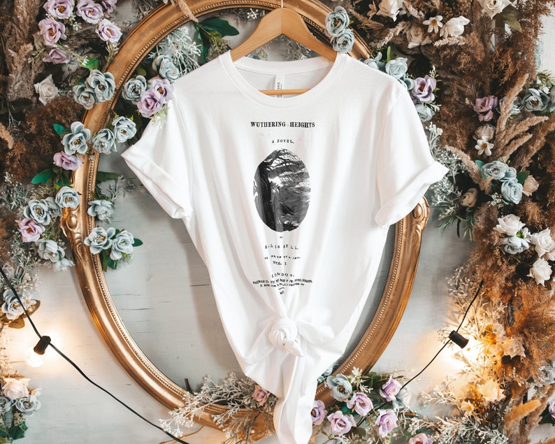 May include: White t-shirt with a black and white illustration of a tree and the text "Wuthering Heights, A Novel" printed on the front.