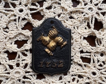 Reproduction cast iron fire company insurance plaque - marked 1752 - gilt accents - vintage