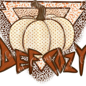 May include: A white pumpkin with orange polka dots is centered in a brown triangle with a brown and orange leopard print background. The word "DEERLY" is written in brown with a striped pattern below the pumpkin.