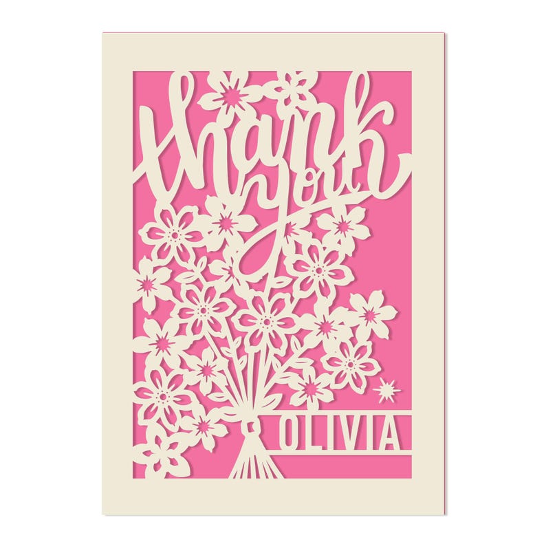 May include: A white card with a pink background and a cut-out design of flowers and the words "thank you". The name "Olivia" is at the bottom of the card.