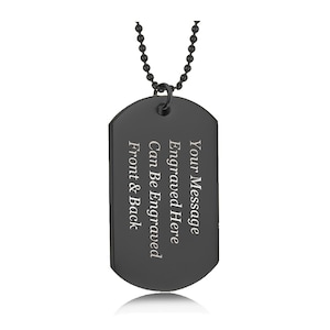 May include: Black metal dog tag necklace with a silver engraved message that reads "Your Message Engraved Here Can Be Engraved Front & Back".