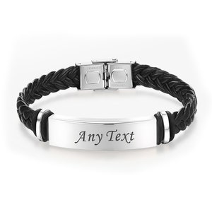 May include: Black leather braided bracelet with a silver stainless steel clasp and a silver rectangular plate engraved with the text "Any Text".
