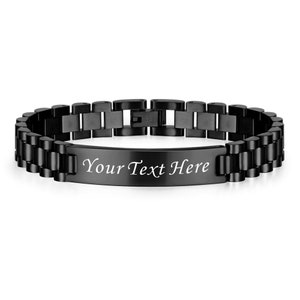 May include: Black stainless steel bracelet with a rectangular tag that says "Your Text Here".