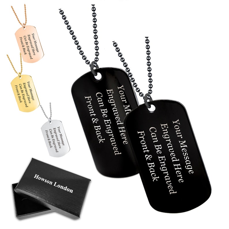May include: Two black dog tag necklaces with silver chains. The tags are engraved with the text "Your Message Engraved Here Can Be Engraved Front & Back".