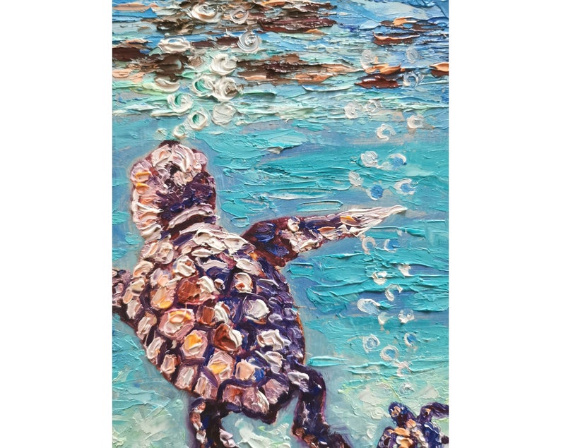 May include: A painting of a sea turtle swimming in turquoise water with white bubbles rising to the surface. The turtle is painted in shades of brown, pink, and purple.