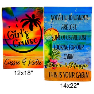 May include: Two rectangular garden flags with beach-themed designs. One flag features the text "Girl's Cruise" with names and measures 12x18 inches. The other flag has a cocktail graphic, text, and measures 14x22 inches.