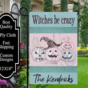 May include: A Halloween garden flag featuring three carved pumpkins, one wearing a witch's hat, with the text "Witches be crazy" and "The Kendricks." The flag measures 12x18 inches.