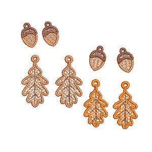May include: A set of six autumn-themed earrings featuring acorn and oak leaf designs. The acorns are brown with a light brown cap and the oak leaves are a light brown with a darker brown outline.