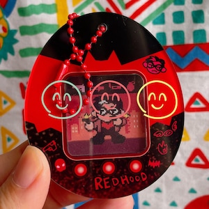 Nightwing & Red Hood Tamagotchi Acrylic Charm with Lenticular Card