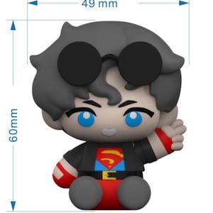 May include: A figurine of a character with black sunglasses, gray hair, and blue eyes. The figure is wearing a black jacket over a red and blue Superman-themed outfit. The figurine measures 1.9 inches wide and 2.4 inches tall.