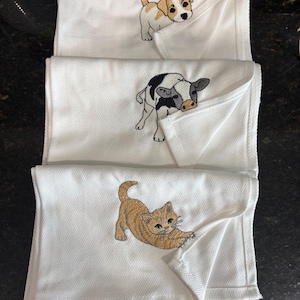 Embroidered tea towels | playful animal foldered corner