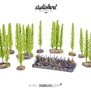 May include: A set of miniature green bushes and a miniature black and gold spiked fence. The bushes are on small grey bases. The fence is on a grey base.